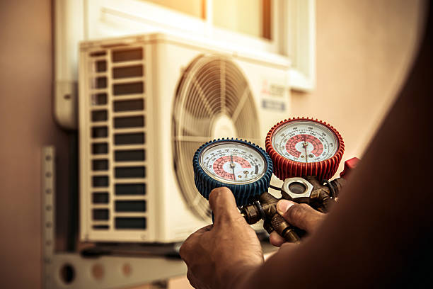 Professional Heat Pump Repair technician working in Saint Joseph, MO